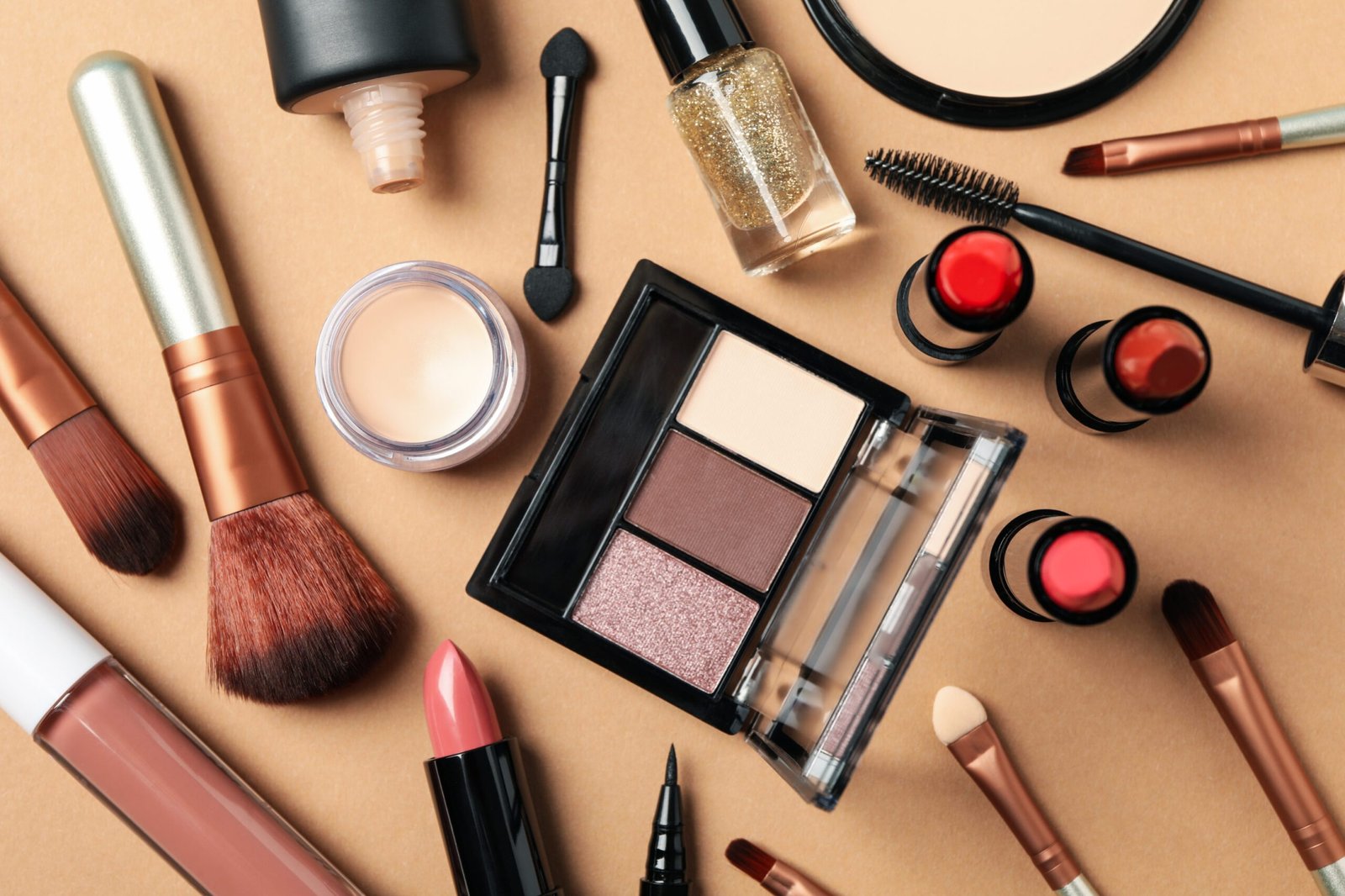 Different makeup cosmetics on brown background. Female accessories