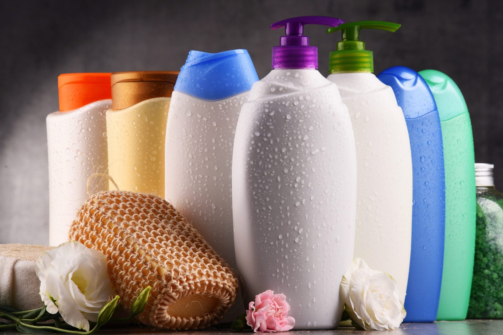 Plastic bottles of body care and beauty products.